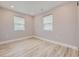 Bright bedroom with light gray walls and wood-look flooring at 3227 N Steele St, Denver, CO 80205