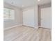 Bedroom featuring ample closet space and light wood floors at 3227 N Steele St, Denver, CO 80205