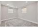 Spacious bedroom with grey carpet and two windows at 3227 N Steele St, Denver, CO 80205