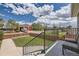 Deck view of yard, wooden fence, and fire station in the distance at 3227 N Steele St, Denver, CO 80205
