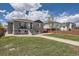 Gray brick home with a landscaped yard, walkway, and modern wooden fence at 3227 N Steele St, Denver, CO 80205