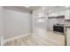 Modern kitchen with stainless steel appliances and light wood floors at 3227 N Steele St, Denver, CO 80205