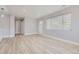 Bright and airy living room featuring light grey walls and vinyl wood flooring at 3227 N Steele St, Denver, CO 80205