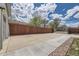 Side yard with a long concrete driveway and a wooden fence at 3227 N Steele St, Denver, CO 80205