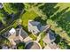 Bird's-eye view of a suburban home with a well-manicured lawn and mature trees, showcasing its location at 5284 Taft Ct, Arvada, CO 80002