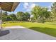 This home features a lush green backyard, mature landscaping, and a concrete patio at 5284 Taft Ct, Arvada, CO 80002