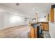 Spacious finished basement featuring a bar area, pool table, carpet, and lighting at 5284 Taft Ct, Arvada, CO 80002