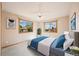 Comfortable bedroom with two windows offering neighborhood views and soft, neutral tones at 5284 Taft Ct, Arvada, CO 80002