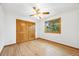 Spacious bedroom with wood floors, ample closet space, and a bright window view at 5284 Taft Ct, Arvada, CO 80002