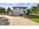 Attractive two-story home with a three-car garage, neutral paint, and a well-maintained driveway and landscaping at 5284 Taft Ct, Arvada, CO 80002