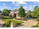Beautiful two-story home boasts a brick facade, lush lawn, mature landscaping, and a welcoming entrance at 5284 Taft Ct, Arvada, CO 80002