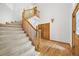 Open foyer with hardwood floors, a carpeted staircase, and a storage closet offers convenient functionality at 5284 Taft Ct, Arvada, CO 80002