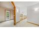 Upstairs hallway has a door leading to a balcony and a wood railing overlooking the living room at 5284 Taft Ct, Arvada, CO 80002