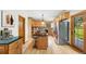 Kitchen has granite counters and an island with barstool seating and stainless steel appliances at 5284 Taft Ct, Arvada, CO 80002