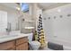 Well-lit bathroom featuring modern fixtures, shower-tub combo, and ample space at 11250 Florence St # 5C, Commerce City, CO 80640