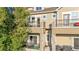 Close up of tan townhome featuring stone accents and dual balconies at 11250 Florence St # 5C, Commerce City, CO 80640