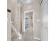 Hallway leading to a bedroom, showcasing neutral colors and carpeted stairs at 11250 Florence St # 5C, Commerce City, CO 80640