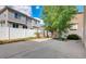 Backyard featuring a patio with a white fence for added privacy and tree for shade at 21093 E 53Rd Ave, Denver, CO 80249