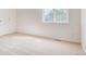 Bright bedroom featuring neutral walls, carpet, and a large window providing natural light at 21093 E 53Rd Ave, Denver, CO 80249