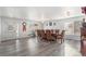 Spacious dining room with updated gray vinyl flooring and large windows for natural light at 21093 E 53Rd Ave, Denver, CO 80249