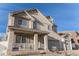 Attractive two-story home featuring a welcoming front porch and an attached two-car garage at 21093 E 53Rd Ave, Denver, CO 80249