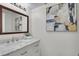 Modern bathroom with marble vanity and updated fixtures at 5401 E Warren Ave # 204, Denver, CO 80222