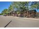 Brick building exterior with wood shake roofs, and balconies at 5401 E Warren Ave # 204, Denver, CO 80222