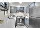 Modern kitchen with stainless steel appliances and gray cabinets at 5401 E Warren Ave # 204, Denver, CO 80222