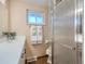 Clean bathroom with a walk-in shower and updated vanity at 2525 Nelson St, Lakewood, CO 80215