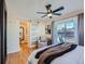 Main bedroom with a sliding barn door to the ensuite bathroom at 2525 Nelson St, Lakewood, CO 80215