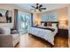 Spacious bedroom with a queen bed and access to a private patio at 2525 Nelson St, Lakewood, CO 80215