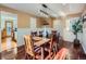 Dining room with hardwood floors, wood table, and kitchen access at 2525 Nelson St, Lakewood, CO 80215