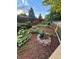 Landscaped garden with various plants and flowers. Includes raised garden beds at 2525 Nelson St, Lakewood, CO 80215