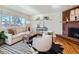 Living room with hardwood floors, fireplace, and stylish decor at 2525 Nelson St, Lakewood, CO 80215