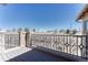 Private balcony with wrought iron railing offering panoramic views of the surrounding landscape at 9274 Viaggio Way, Highlands Ranch, CO 80126