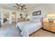 Spacious bedroom with neutral walls, large windows and a ceiling fan at 9274 Viaggio Way, Highlands Ranch, CO 80126