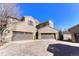 Stunning stone-clad home with multiple garages and meticulously paved driveway at 9274 Viaggio Way, Highlands Ranch, CO 80126