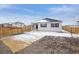 A spacious backyard featuring a level yard, wooden fence and patio at 13705 Siltstone Pl, Mead, CO 80504