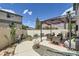 Well-maintained backyard with a patio area, outdoor seating, and landscaping creating an inviting outdoor space at 5153 Andes Way, Denver, CO 80249