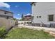 Fenced backyard with a well-manicured lawn, a cozy seating area, and mature landscaping for outdoor enjoyment at 5153 Andes Way, Denver, CO 80249