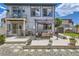 Spacious backyard featuring a covered patio, seating, shed, playhouse, and stone path, perfect for outdoor entertaining at 5153 Andes Way, Denver, CO 80249