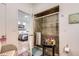 Bathroom with a tile shower, decorative table, and access to the bedroom at 5153 Andes Way, Denver, CO 80249