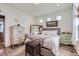 Cozy bedroom with hardwood floors and decor at 5153 Andes Way, Denver, CO 80249