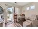 Bright bedroom area featuring a crib, natural light, and hardwood floors at 5153 Andes Way, Denver, CO 80249