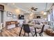 Open concept space featuring a glass table with room to see the living room and kitchen at 5153 Andes Way, Denver, CO 80249