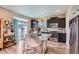 Kitchen featuring stainless steel appliances, granite countertops and an island with seating at 5153 Andes Way, Denver, CO 80249
