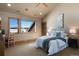 Comfortable bedroom with ample natural light and views of the snow-capped mountains at 19155 Lochmere Ct, Monument, CO 80132