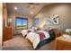 Inviting guest bedroom with two beds, a window view, and light-filled charm at 19155 Lochmere Ct, Monument, CO 80132