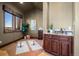 Bonus room with custom cabinets, a sink and scenic views from the window at 19155 Lochmere Ct, Monument, CO 80132