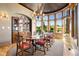 Formal dining room featuring hardwood floors, a chandelier and large windows with scenic views at 19155 Lochmere Ct, Monument, CO 80132
